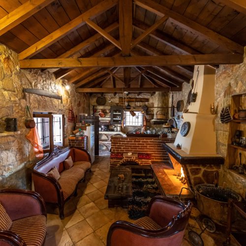 Cozy Living Room with Fireplace at Vintage Stone House, Amarianos, Greece